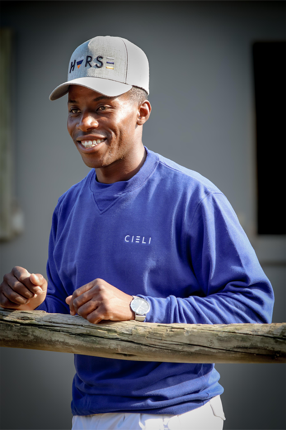 Man wearing a Cieli Equestrian royal blue sweater