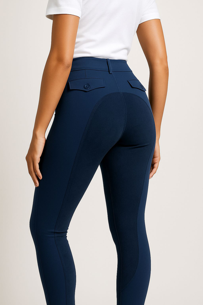 Navy riding pants worn by a person on a plain background