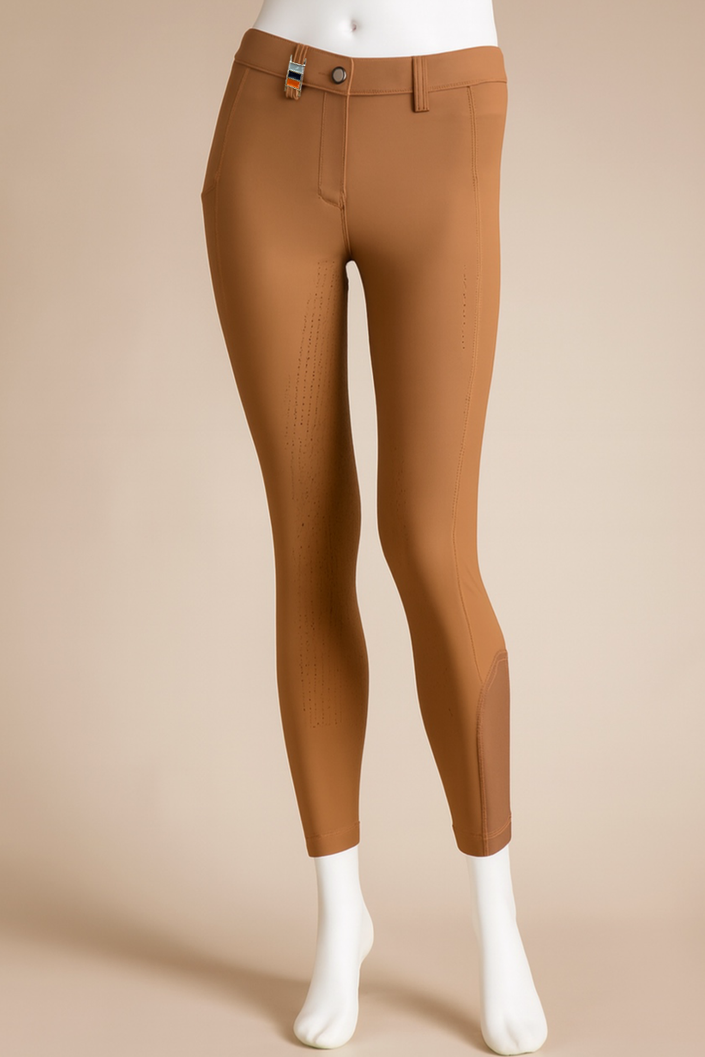 Brown riding pants on a beige background