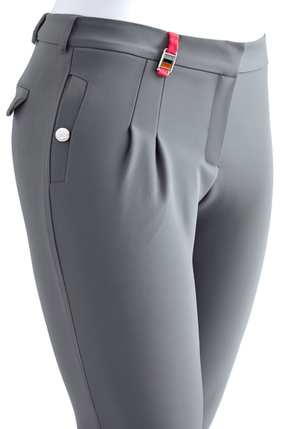 Gray riding pants with a orange strap on a white background