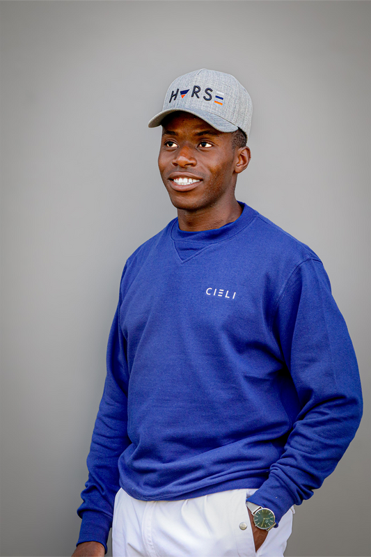 Man wearing a Cieli Equestrian royal blue sweater